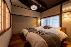 Postel nebo postele na pokoji v ubytování Mibu Momiji