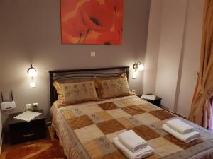 מיטה או מיטות בחדר ב-Ariadni