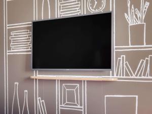 Télévision ou salle de divertissement dans l'établissement ibis Saint Germain en Laye Centre