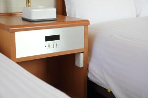 Postel nebo postele na pokoji v ubytování Toyooka Sky Hotel