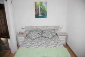 Łóżko lub łóżka w pokoju w obiekcie Piso das Costureiras