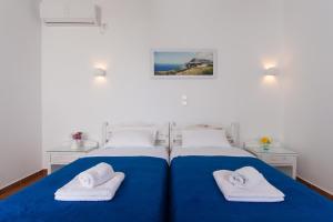 Postel nebo postele na pokoji v ubytování Aegeo Hotel