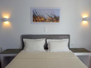 Postel nebo postele na pokoji v ubytování Aegeo Hotel
