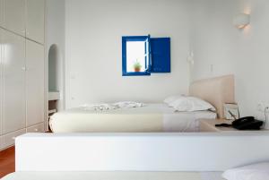 Postel nebo postele na pokoji v ubytování Aegeo Hotel