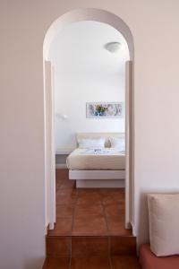 Postel nebo postele na pokoji v ubytování Aegeo Hotel