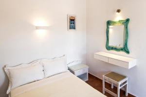 Postel nebo postele na pokoji v ubytování Aegeo Hotel