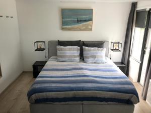 Een bed of bedden in een kamer bij Sea la vie