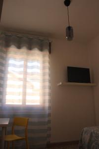 TV a/nebo společenská místnost v ubytování Casa Madè