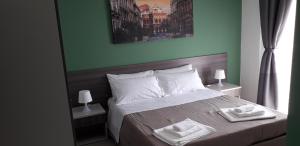 En eller flere senge i et værelse på Borgo Palombaio 2