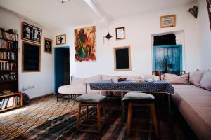 a living room with a couch and a table at Dar Randigaba in Taroudant