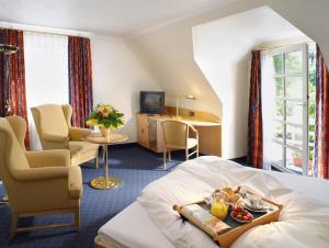 Postel nebo postele na pokoji v ubytování Hotel Albus