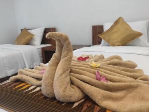 Postel nebo postele na pokoji v ubytování Gedhong Hostel