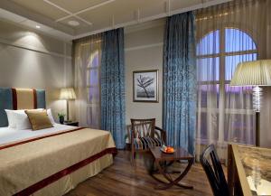 מיטה או מיטות בחדר ב-מלון המלך דוד ירושלים
