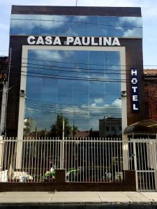 a building with a sign on the side of it at Hotel Casa Paulina in Bogotá