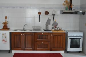 Kuchyň nebo kuchyňský kout v ubytování Casa Le Anfore