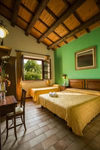 Giường trong phòng chung tại Country House Il Cascinale