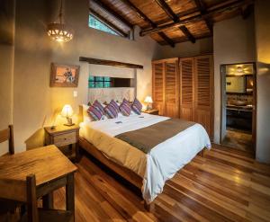 מיטה או מיטות בחדר ב-Sacred Dreams Lodge