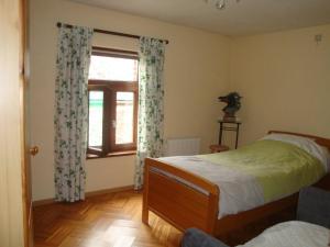 Ένα ή περισσότερα κρεβάτια σε δωμάτιο στο Le Clos des Hirondelles