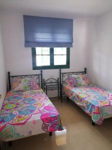 Ένα ή περισσότερα κρεβάτια σε δωμάτιο στο La Palmita House Flat
