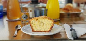 a piece of cake on a plate on a table at La Caletta in Santa Flavia