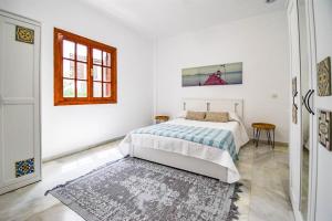 Łóżko lub łóżka w pokoju w obiekcie VILLA BAHIA AZUL