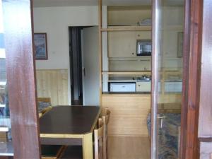 a room with a kitchen with a counter top at Fontaines Blanches 320 in Avoriaz