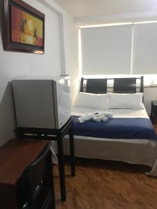 Voodi või voodid majutusasutuse Hotel Casa Paulina toas