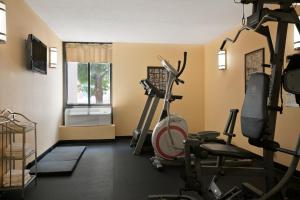 a gym with exercise equipment and a window at Days Inn by Wyndham Reading Wyomissing in Reading