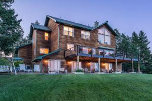 a large wooden house with a large yard at Outlook Inn Bed and Breakfast in Somers