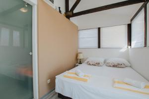 Postel nebo postele na pokoji v ubytování Capri House