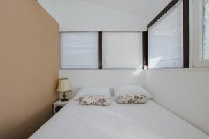 Postel nebo postele na pokoji v ubytování Capri House