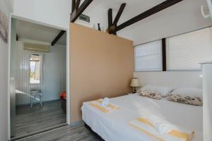 Postel nebo postele na pokoji v ubytování Capri House