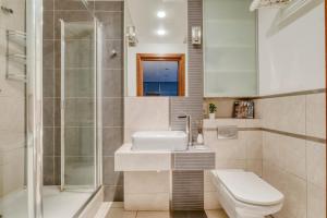 Ένα μπάνιο στο Noctis Apartment Śliska