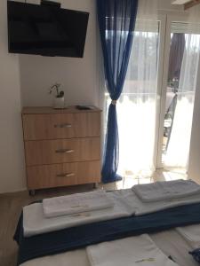 A bed or beds in a room at MAGO APARTMENTS