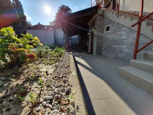 a walkway next to a house with a building at Rooms Korina in Samobor