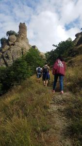 a group of people walking down a hill at Oasis in Aspindza