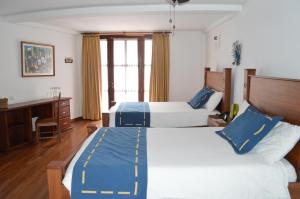 Cama o camas de una habitación en Casa Ceibo Hotel