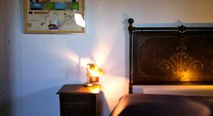 Ένα ή περισσότερα κρεβάτια σε δωμάτιο στο Residenza d'Epoca La Commenda