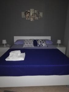 Ένα ή περισσότερα κρεβάτια σε δωμάτιο στο Anchida casa vacanze