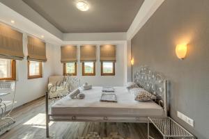 Posteľ alebo postele v izbe v ubytovaní Harmony Deluxe Villas