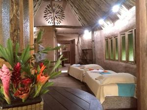 Postel nebo postele na pokoji v ubytování Ecolodge Cosmogénesis