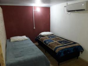 Кровать или кровати в номере Complejo Celeste