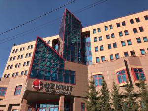 a building with a sign on the front of it at AZIMUT Hotel Yakutsk in Yakutsk