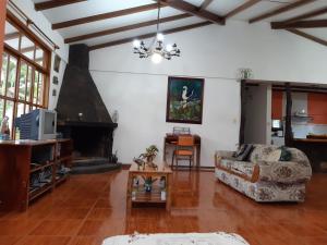 a living room with a couch and a table at Suymar Ecolodge Galapagos in Puerto Ayora