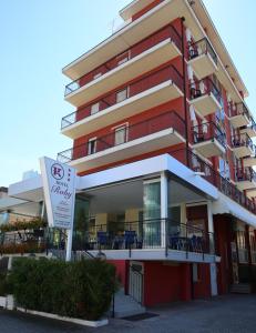 a building with a sign in front of it at Hotel Roby in Lido di Jesolo