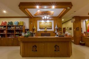 a shop with a counter in a store at Loei Village Hotel in Loei