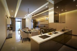 a kitchen and living room with a dining room at Dorsett Kuala Lumpur in Kuala Lumpur