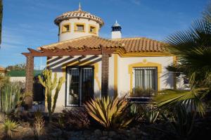 a house with a lighthouse on top of it at Villa Ensueño with private pool and large garden in Mazarrón