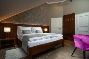 Posteľ alebo postele v izbe v ubytovaní Hotel Anna