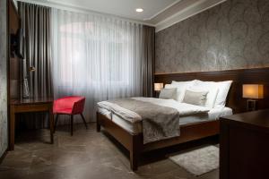 Posteľ alebo postele v izbe v ubytovaní Hotel Anna
